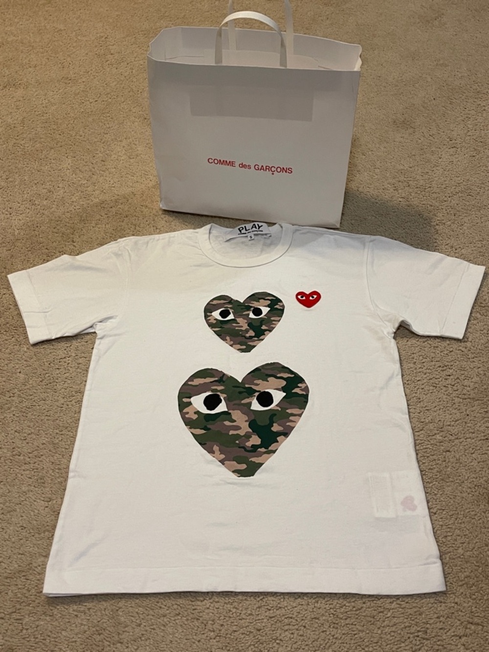 Comme des Garçons PLAY White Tee with Camouflage Heart Eyes and Red Logo